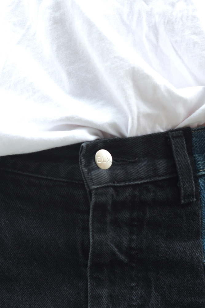 A close up of the 50s model wearing E.L.V. Denim trousers.